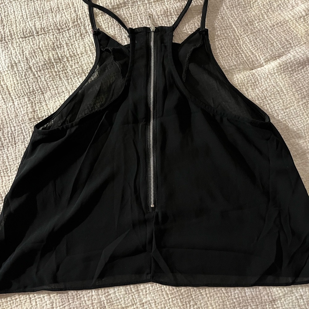 black zippered crop sheer shirt.